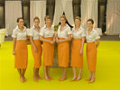 Charming hostesses in a specific Schweighofer Prize outfit welcome the guests in...